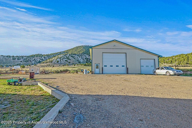 4050 County Road 7, Craig, CO 81625 - detached garage featuring a mountain view