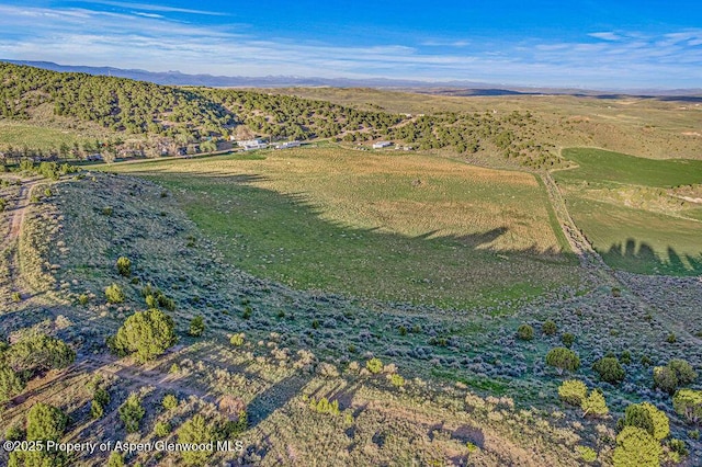 4050 County Road 7, Craig, CO 81625 - aerial view of property and surrounding area featuring a mountainous background