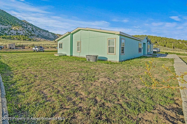 4050 County Road 7, Craig, CO 81625 - view of property exterior featuring a yard and a mountain view