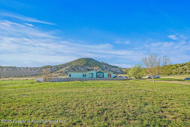 4050 County Road 7, Craig, CO 81625 - rear view of property featuring a mountain view and a yard