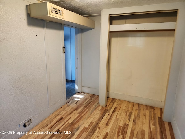 1004 Elm Ave, Collbran, CO 81624 - unfurnished bedroom featuring light wood-type flooring