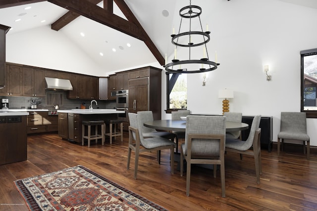 dining area with dark wood-style floors, high vaulted ceiling, beam ceiling, and a notable chandelier