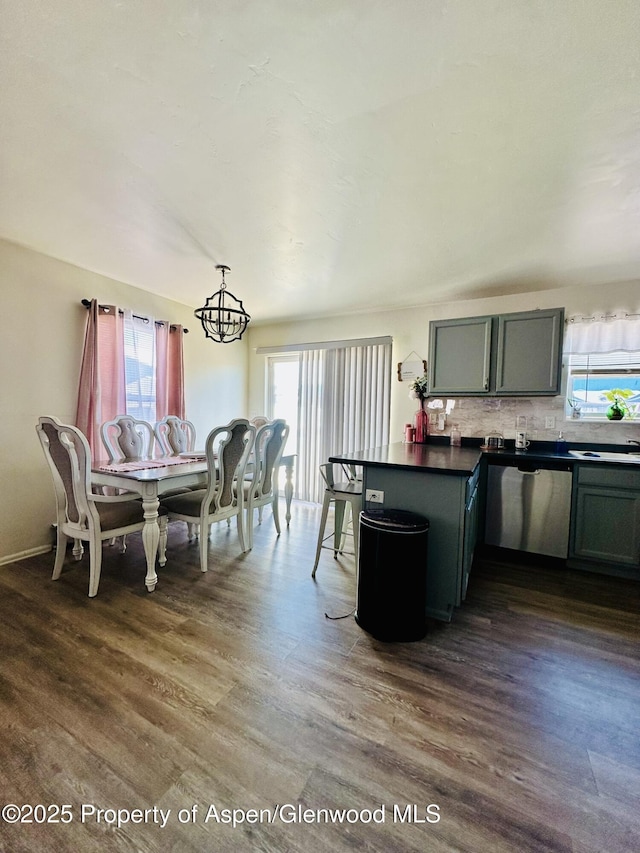 2529 Meadow Cir, Rifle, CO 81650 - dining room featuring plenty of natural light and dark wood-style flooring