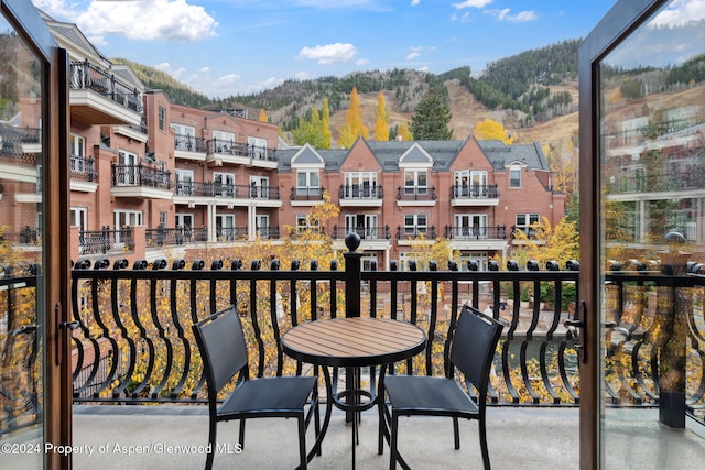 balcony featuring a mountain view