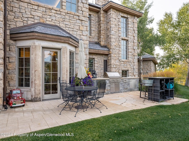 view of patio / terrace with area for grilling and exterior kitchen