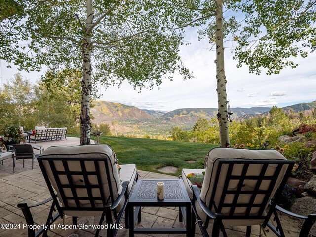 view of patio featuring outdoor lounge area and a mountain view