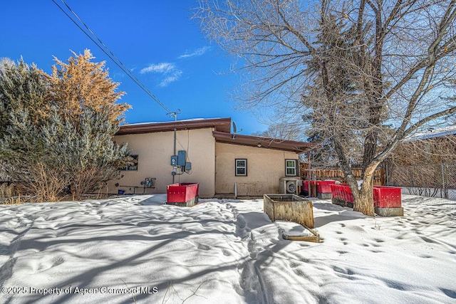 view of snow covered house