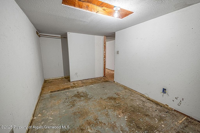 unfurnished bedroom featuring a closet and a textured ceiling