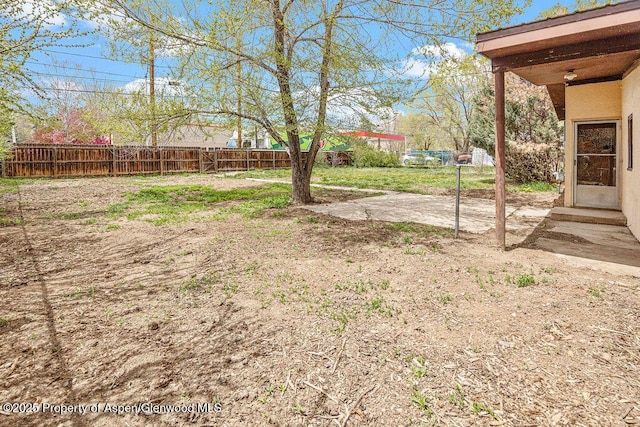 fenced backyard featuring a patio area