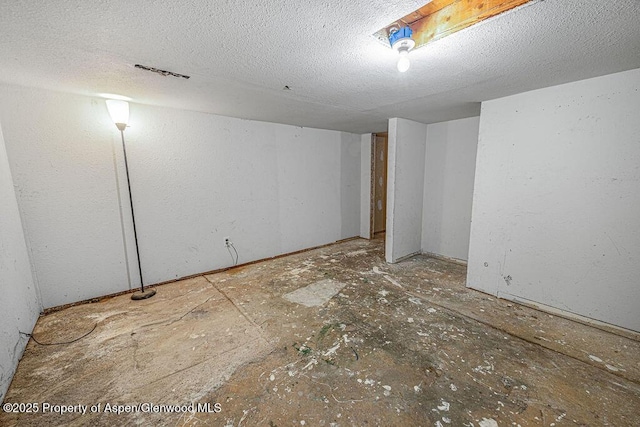 interior space featuring a textured ceiling