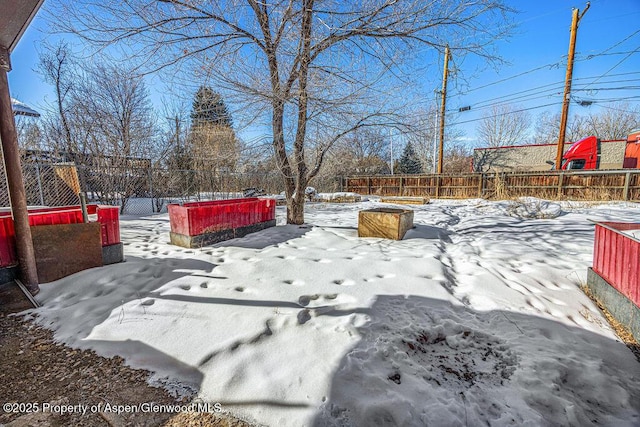 view of yard layered in snow