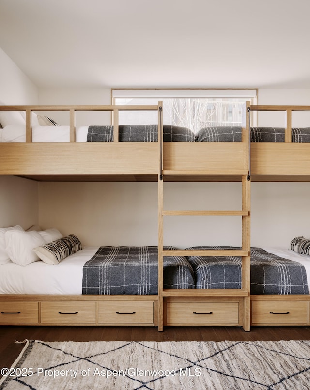 unfurnished bedroom with wood finished floors