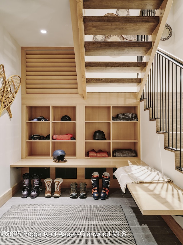 wine cellar with recessed lighting and baseboards
