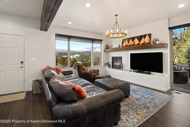 236 Paintbrush Way, Glenwood Springs, CO 81601 - living room with recessed lighting, wood finished floors, a notable chandelier, and beamed ceiling