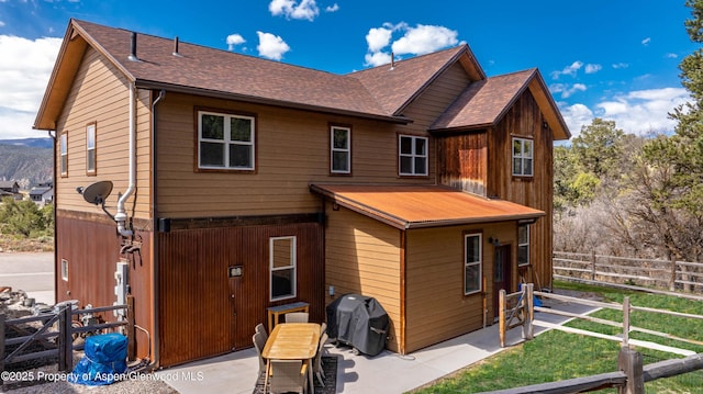 236 Paintbrush Way, Glenwood Springs, CO 81601 - back of property featuring roof with shingles, fence, and a patio area