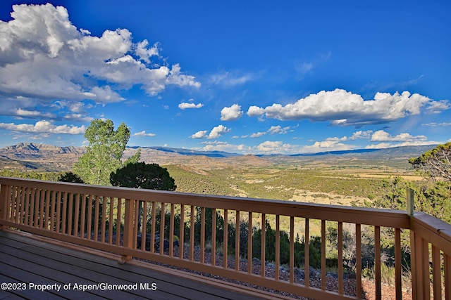 wooden terrace with a mountain view