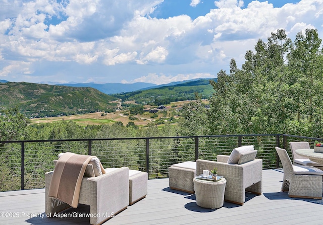 wooden terrace with a mountain view