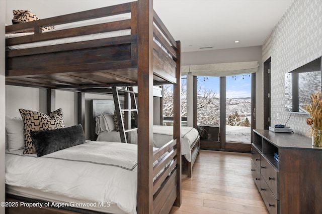 bedroom with light hardwood / wood-style flooring