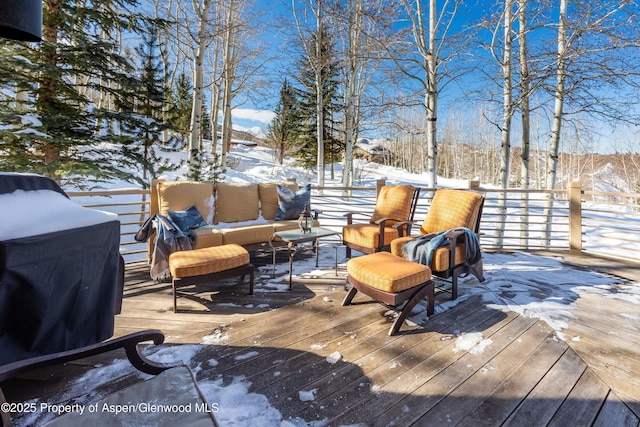 snow covered deck with an outdoor hangout area