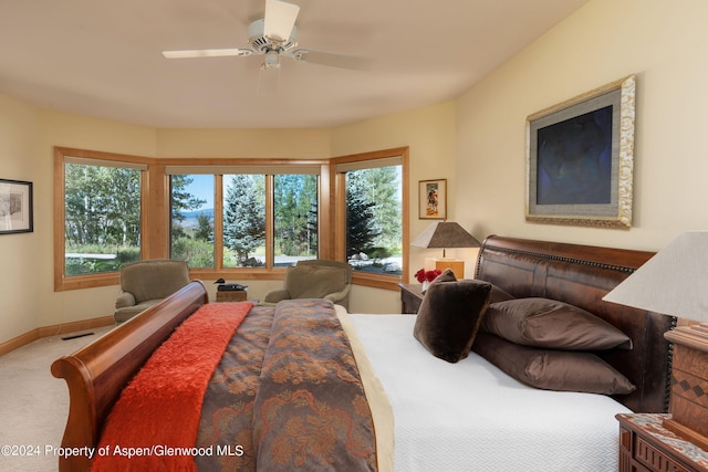 bedroom with ceiling fan and carpet flooring