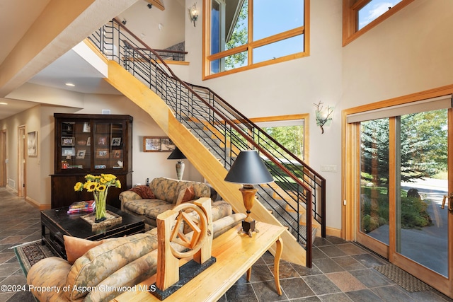 living room with a high ceiling