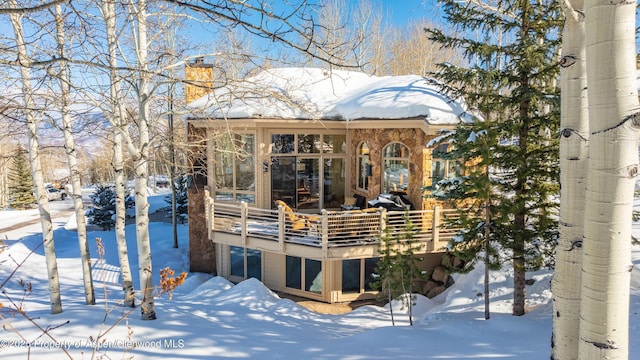 view of snow covered house