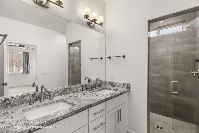 1 Eagle Claw Cir, Glenwood Springs, CO 81601 - full bath featuring ceiling fan, double vanity, a stall shower, and a sink