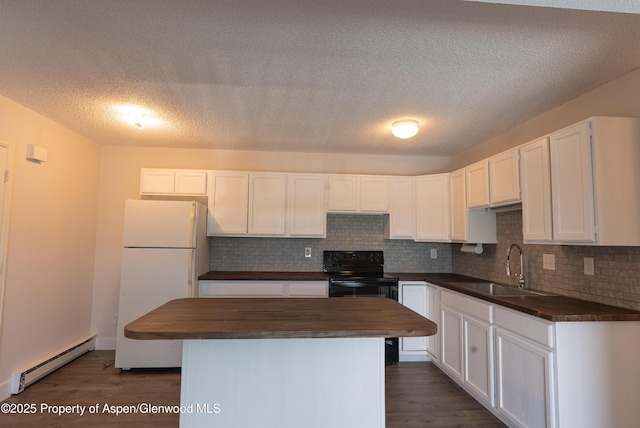 2655 Acacia Ave, Rifle, CO 81650 - kitchen featuring freestanding refrigerator, a baseboard radiator, butcher block countertops, black electric range, and a kitchen island