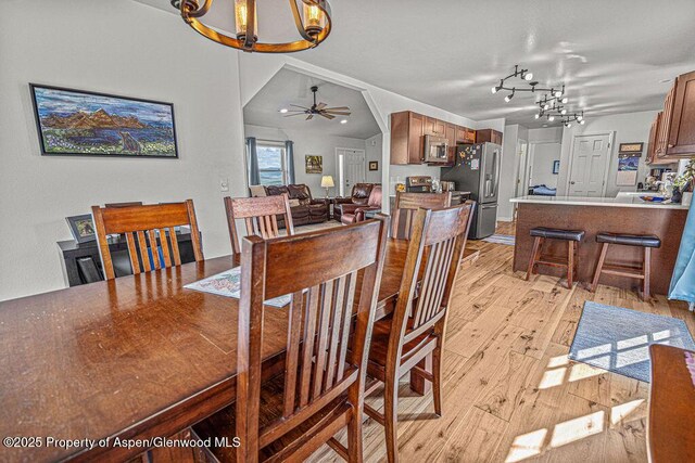 1321 Lecuyer Dr, Craig, CO 81625 - dining area featuring a chandelier, light wood-type flooring, and a ceiling fan