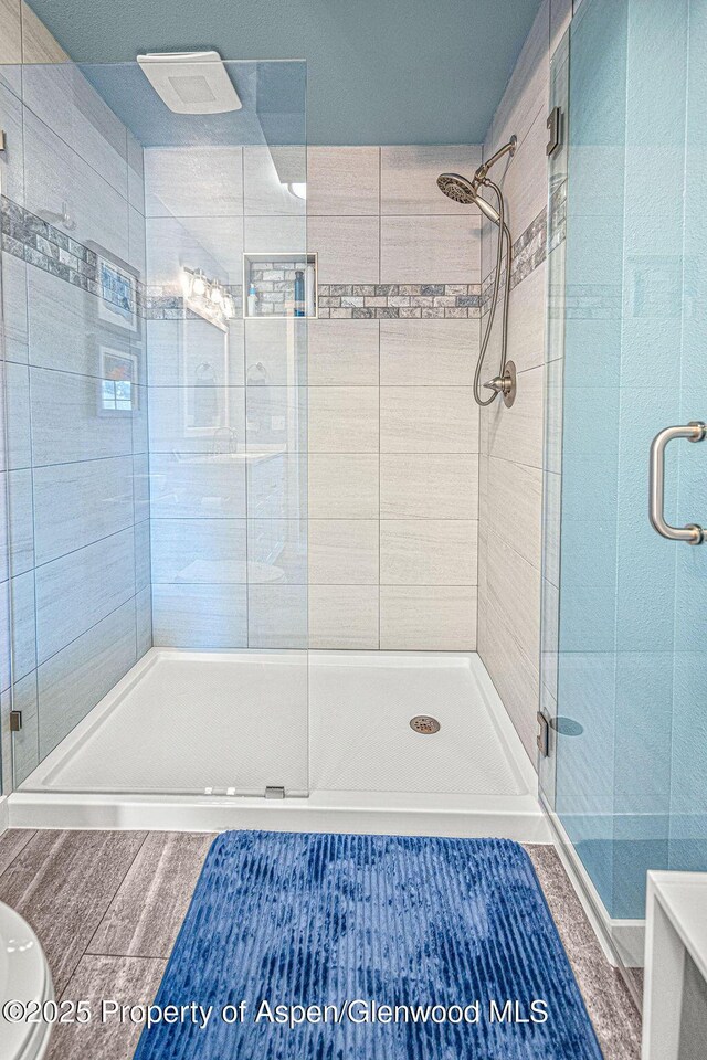1321 Lecuyer Dr, Craig, CO 81625 - full bathroom featuring a stall shower and wood finished floors
