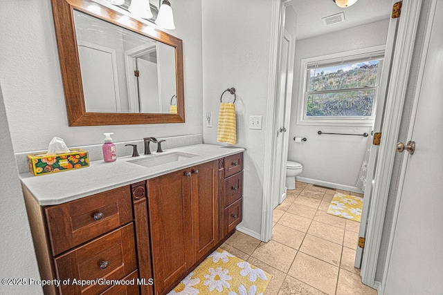 1321 Lecuyer Dr, Craig, CO 81625 - bathroom with vanity, toilet, tile patterned flooring, and baseboards