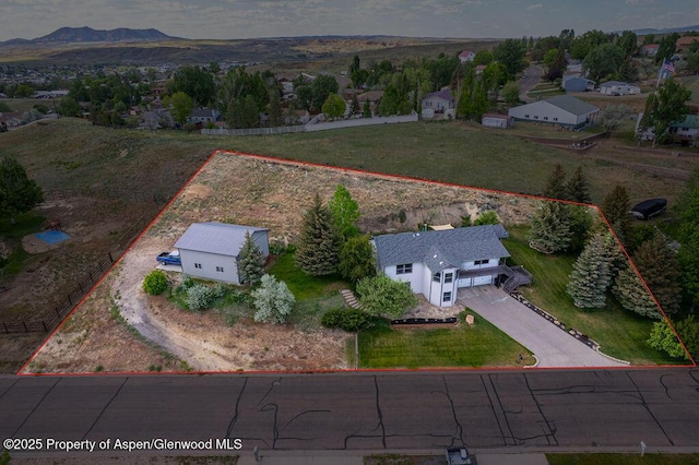 1321 Lecuyer Dr, Craig, CO 81625 - aerial view of property and surrounding area featuring property boundaries highlighted and a mountainous background