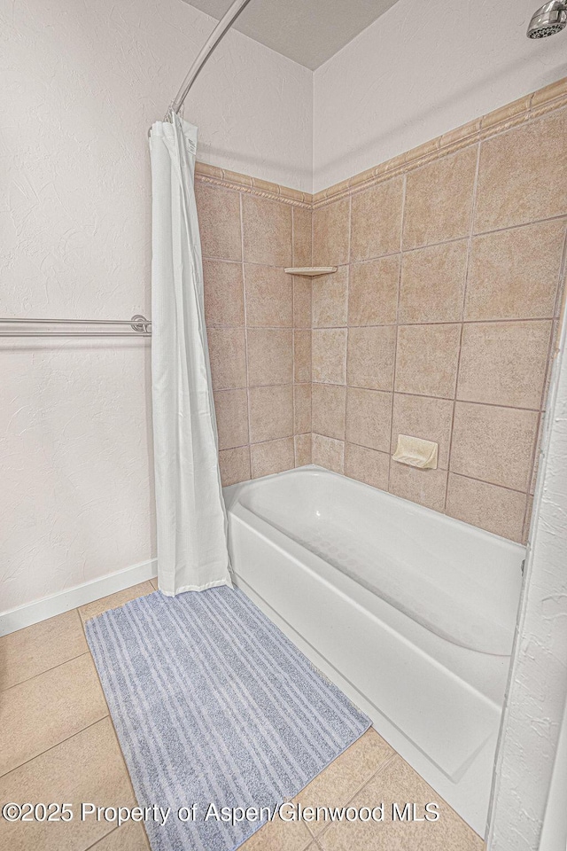 1321 Lecuyer Dr, Craig, CO 81625 - bathroom featuring shower / tub combo, tile patterned floors, baseboards, and a textured wall