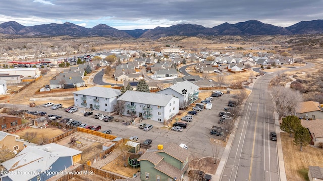 birds eye view of property featuring a mountain view