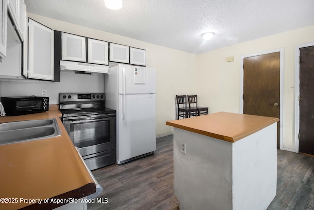 kitchen with sink, stainless steel electric range, white refrigerator, white cabinets, and dark hardwood / wood-style flooring