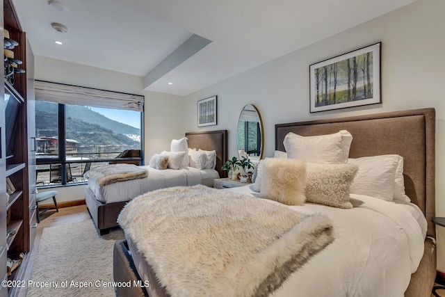 45 Wood Rd Unit 301, Snowmass Village, CO 81615 - bedroom with a mountain view, wood finished floors, and recessed lighting
