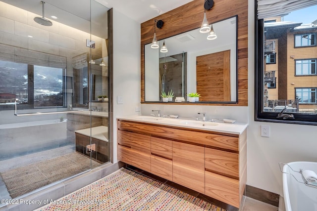 45 Wood Rd Unit 301, Snowmass Village, CO 81615 - bathroom featuring a shower stall and double vanity