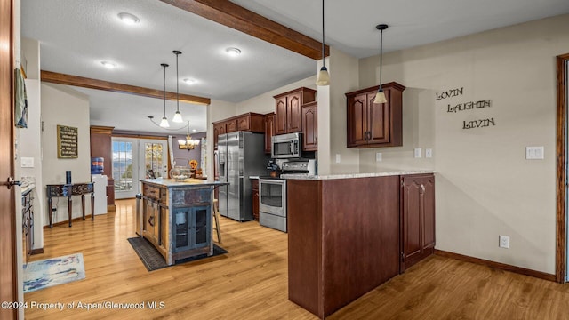 kitchen featuring decorative light fixtures, appliances with stainless steel finishes, a kitchen island, beam ceiling, and light hardwood / wood-style floors