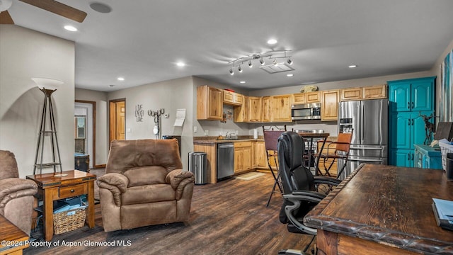 home office with dark wood-type flooring and sink