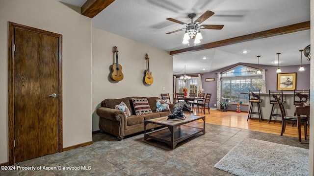 living room with lofted ceiling with beams and ceiling fan with notable chandelier