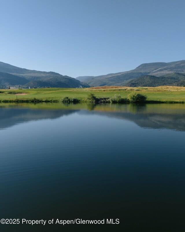 property view of water featuring a mountain view