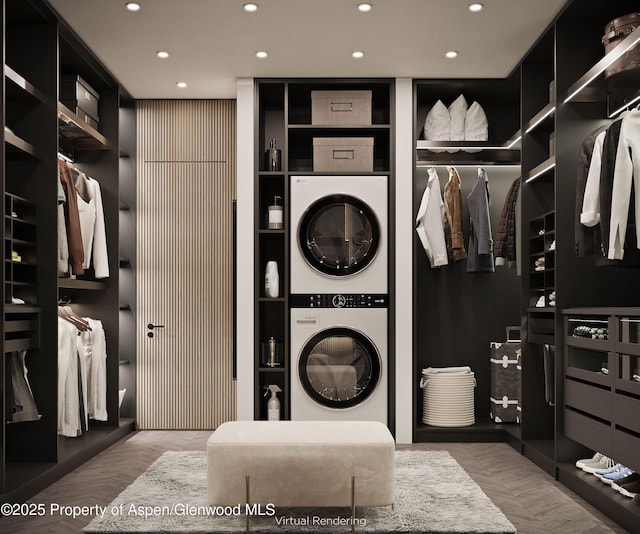 walk in closet featuring stacked washing maching and dryer