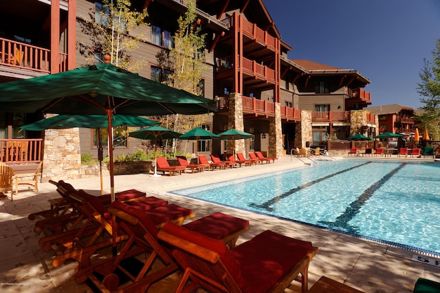 0075 Prospector Rd Unit 8405Summer Interest, Aspen, CO 81611 - community pool featuring a patio area