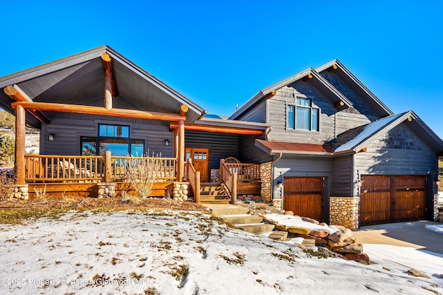 view of front of house featuring a garage and covered porch