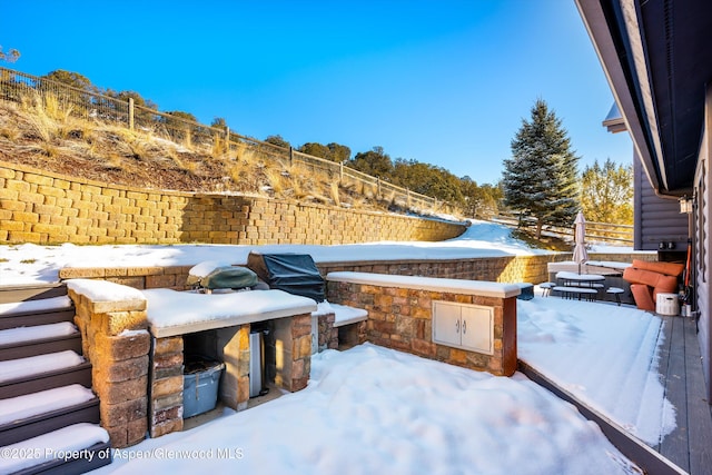 view of snow covered patio