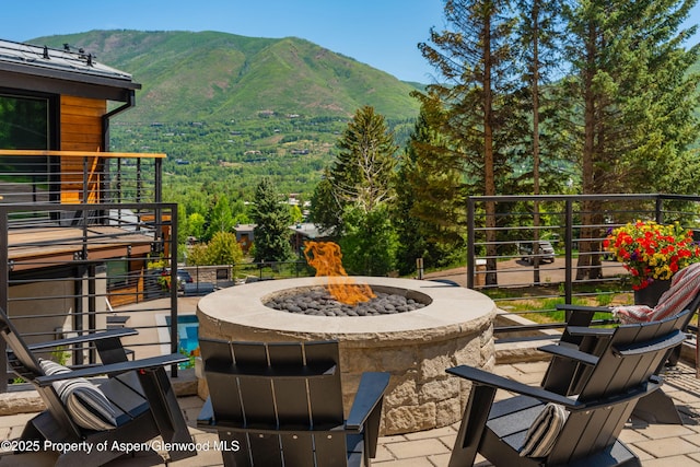 809 S Aspen St Unit 8, Aspen, CO 81611 - view of patio with a mountain view and a fire pit