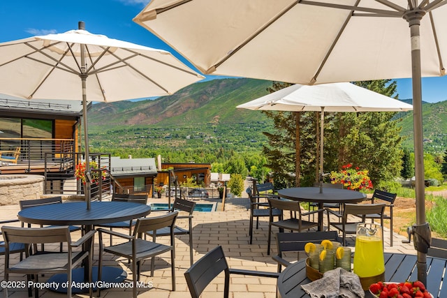 809 S Aspen St Unit 8, Aspen, CO 81611 - view of patio / terrace featuring outdoor dining area and a mountain view