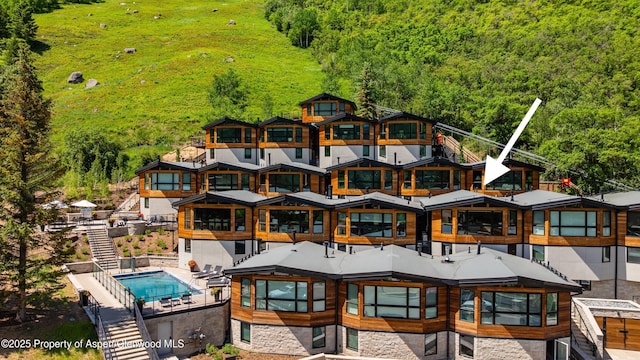 809 S Aspen St Unit 8, Aspen, CO 81611 - bird's eye view of a forest and a pool area