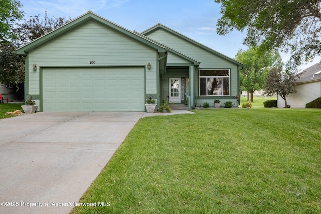 100 Limberpine Cir, Parachute, CO 81635 - view of front of home featuring a garage, concrete driveway, and a front yard