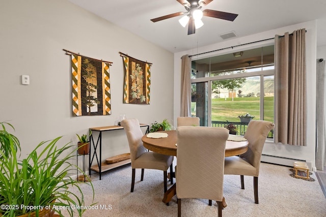100 Limberpine Cir, Parachute, CO 81635 - dining space featuring carpet flooring, a ceiling fan, and a baseboard radiator